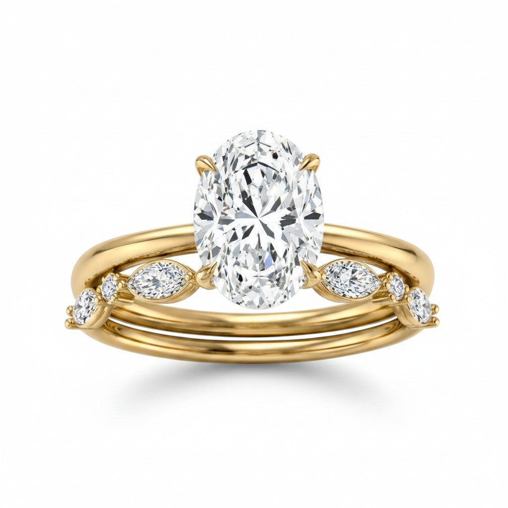 My Store 4 18K solid gold bridal ring set featuring a 1.5ct oval lab-grown diamond with marquise and round accents.