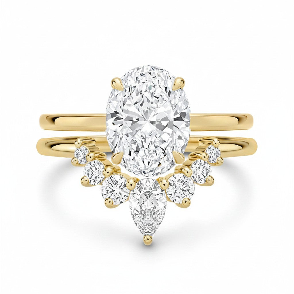 My Store 4 18K solid gold bridal ring set with a 1.5ct oval lab-grown diamond and pear-shaped accent stones.