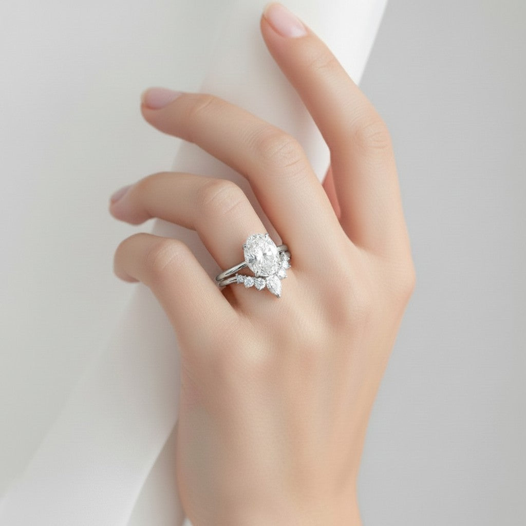 My Store 4 18K solid gold bridal set featuring a 1.5ct oval lab-grown diamond with a pear-accented contour band.