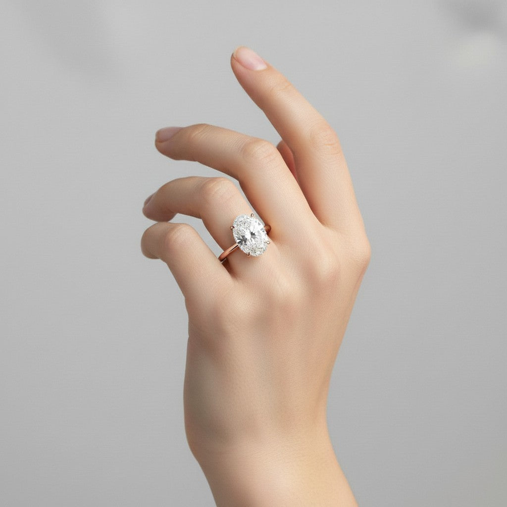 My Store 4 oval cut diamond engagement ring with a hidden halo and micro-pavé cathedral shoulders on a gold band.