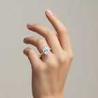 My Store 4 18K yellow gold oval lab grown diamond solitaire ring with a cathedral setting on a woman's hand