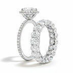 My Store 4 oval diamond halo engagement ring and matching oval eternity wedding band set in white gold.