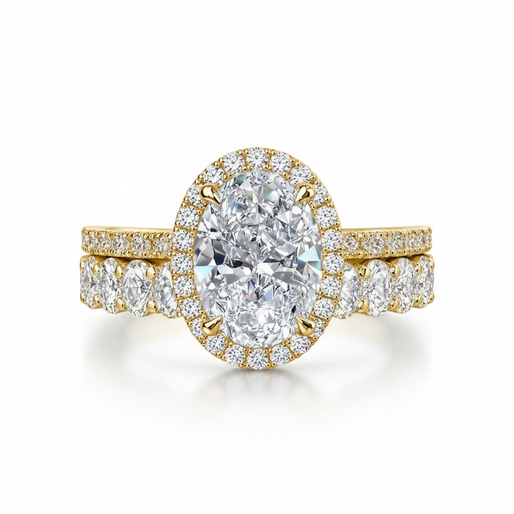 My Store 4 oval diamond halo engagement ring and matching eternity band set in 18K yellow gold on white background.