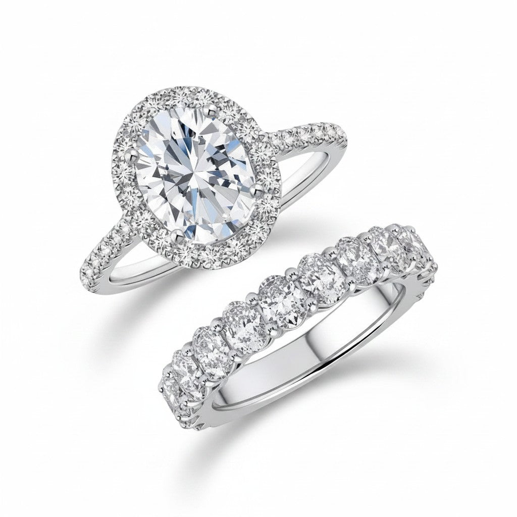 My Store 4 oval diamond halo engagement ring and matching oval eternity wedding band set in polished white gold.