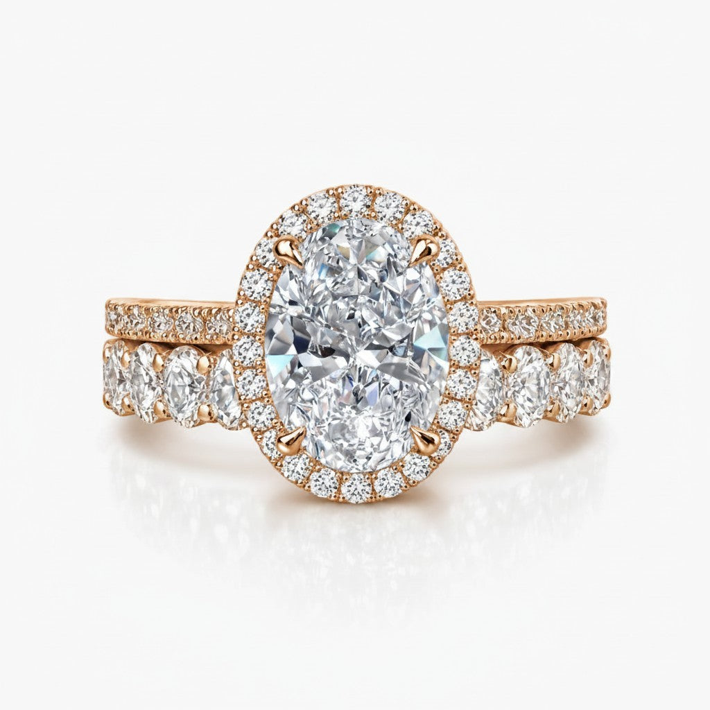 My Store 4 oval diamond halo engagement ring and matching oval eternity wedding band set in rose gold.