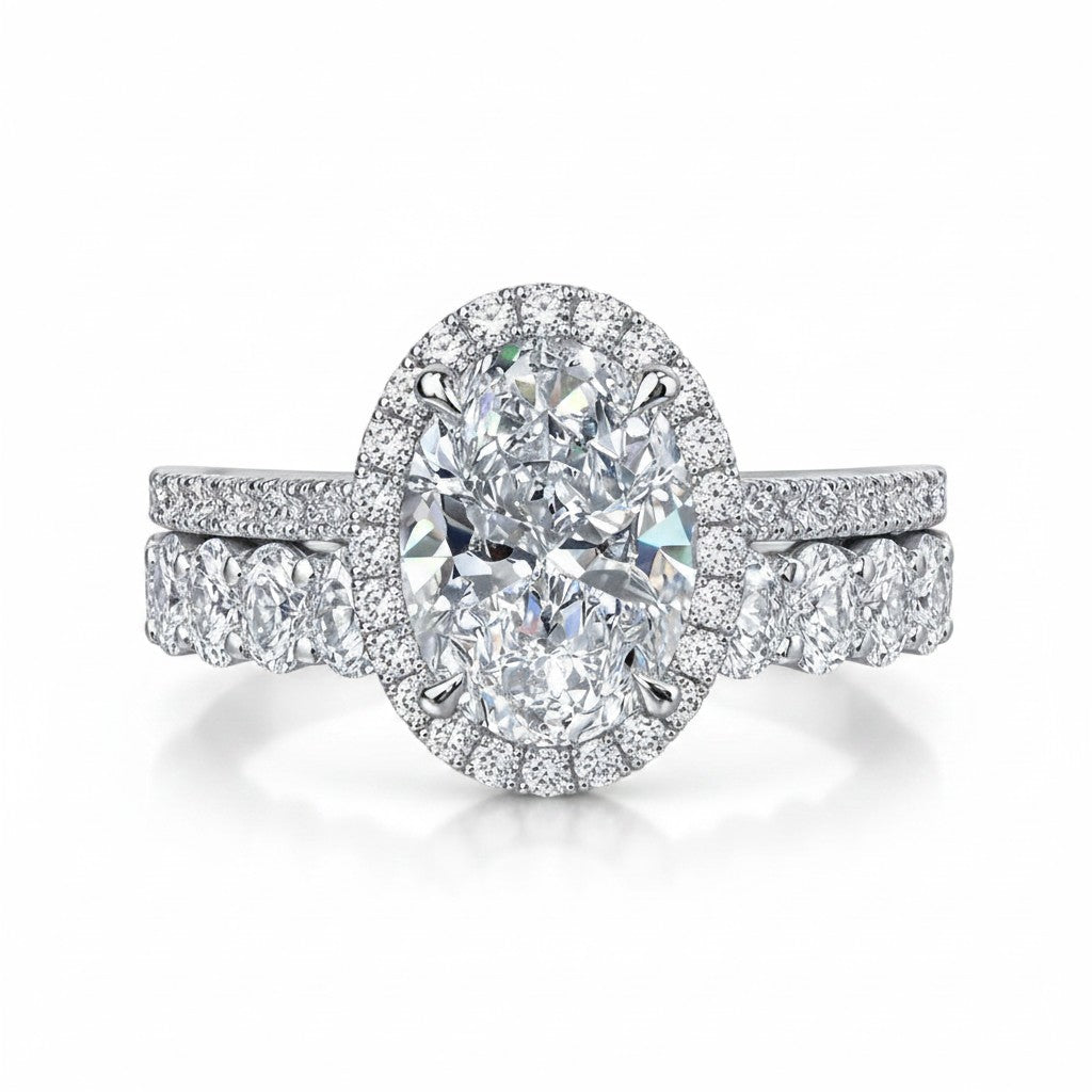 My Store 4 oval diamond halo engagement ring and matching oval eternity wedding band set in white gold.