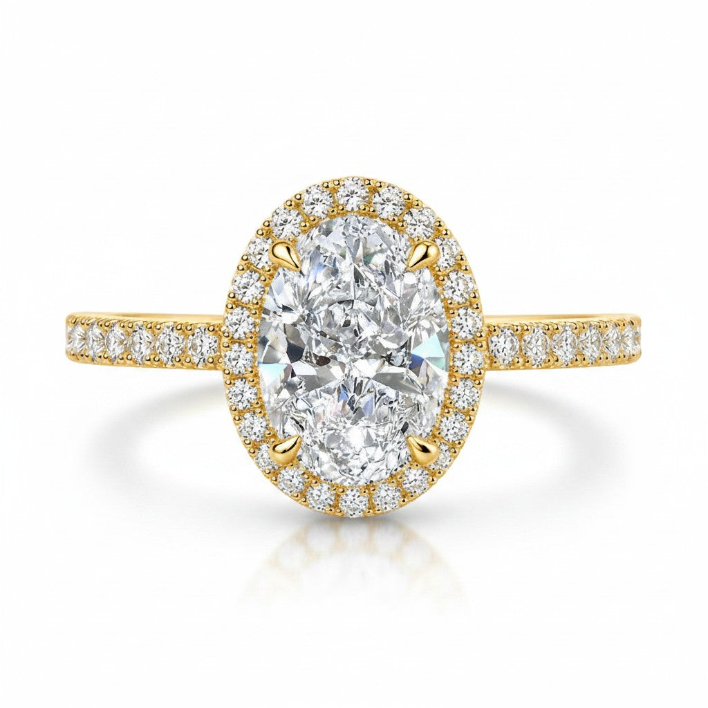 My Store 4 oval diamond halo engagement ring in 18K yellow gold with a micro-pavé diamond shank on a white background.