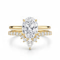 My Store 4 18K solid gold bridal set featuring an oval lab-grown diamond solitaire and a V-shaped pavé wedding band.