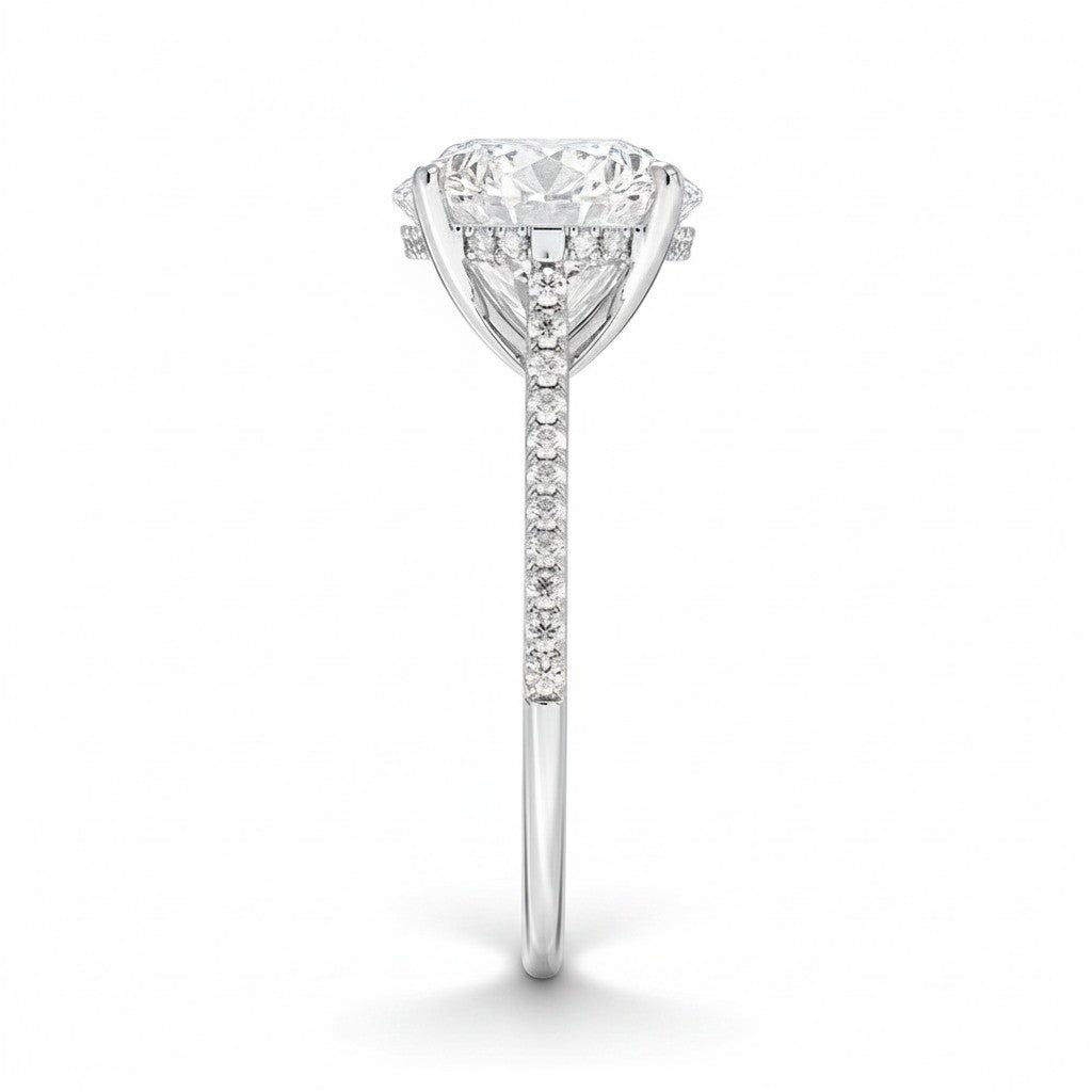 My Store 4 18K white gold oval lab-grown diamond ring with a cathedral setting, hidden halo, and pavé band side view.