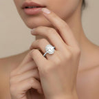 My Store 4 18K white gold oval lab-grown diamond engagement ring with a hidden halo and pavé band on a woman's finger