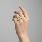 My Store 4 18K solid gold trilogy ring featuring an oval fancy yellow lab-grown diamond on a woman's hand