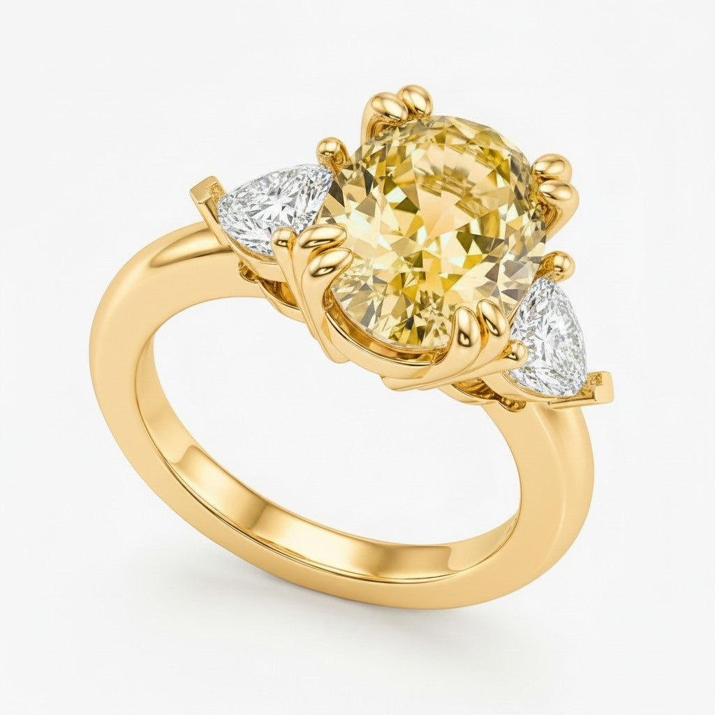 My Store 4 18K solid gold trilogy ring featuring an oval fancy yellow lab-grown diamond with side stones.