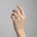 My Store 4 18K solid gold trilogy ring featuring an oval fancy yellow lab-grown diamond on a woman's hand