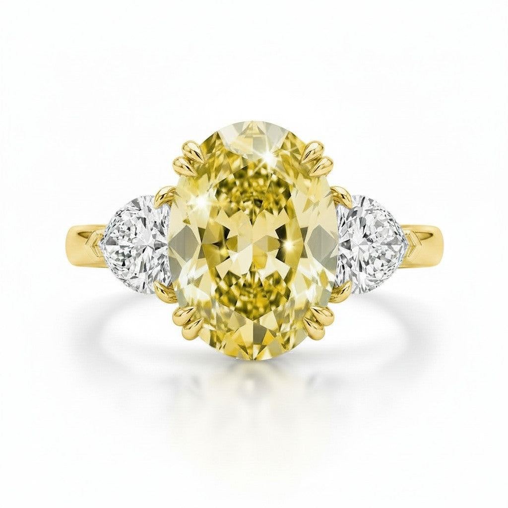 My Store 4 18K solid gold trilogy ring featuring a fancy yellow oval lab-grown diamond with two side diamonds.