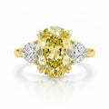 My Store 4 18K solid gold trilogy ring featuring a fancy yellow oval lab-grown diamond with two side diamonds.