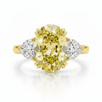 My Store 4 18K solid gold trilogy ring featuring a fancy yellow oval lab-grown diamond with two side diamonds.