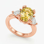 My Store 4 18K rose gold trilogy ring featuring an oval fancy yellow lab-grown diamond and two side diamonds.
