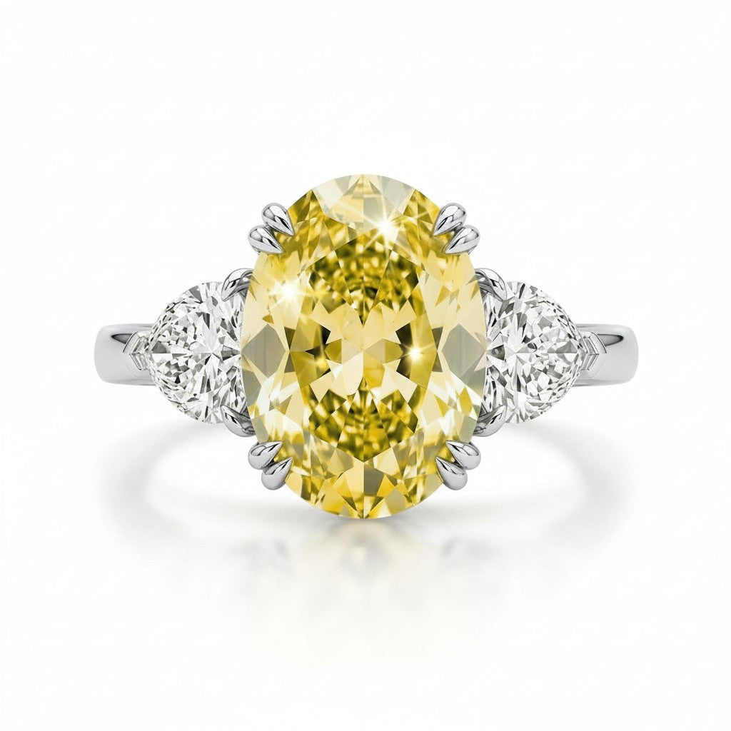 My Store 4 18K solid gold trilogy ring featuring a vibrant oval-cut fancy yellow lab-grown diamond and side stones.