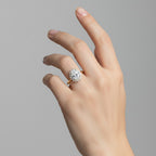 My Store 4 18K solid gold oval halo diamond ring worn on a woman's finger, showcasing vintage-inspired elegance.