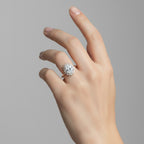 My Store 4 18K solid gold oval halo diamond ring worn on a woman's finger, featuring a vintage-inspired design.