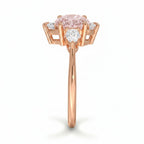 My Store 4 18K rose gold ring featuring an oval fancy color diamond centerpiece with heart-cut side diamonds