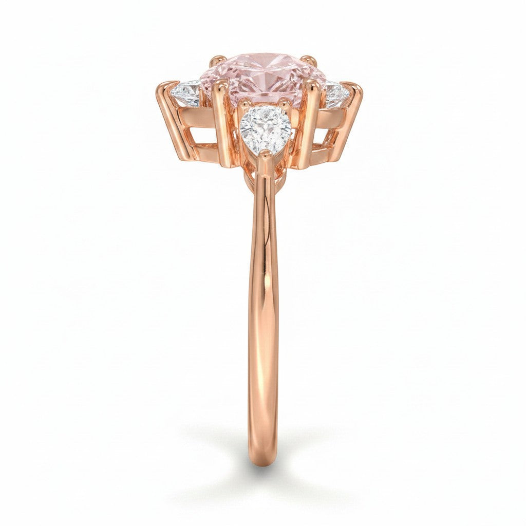 My Store 4 18K rose gold ring featuring an oval fancy color diamond centerpiece with heart-cut side diamonds