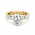 My Store 4 18K solid gold oval lab diamond engagement ring set with a pavé band on a white background.