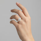 My Store 4 18K solid gold engagement ring set featuring an oval-cut lab-grown diamond and a pavé band on a hand.
