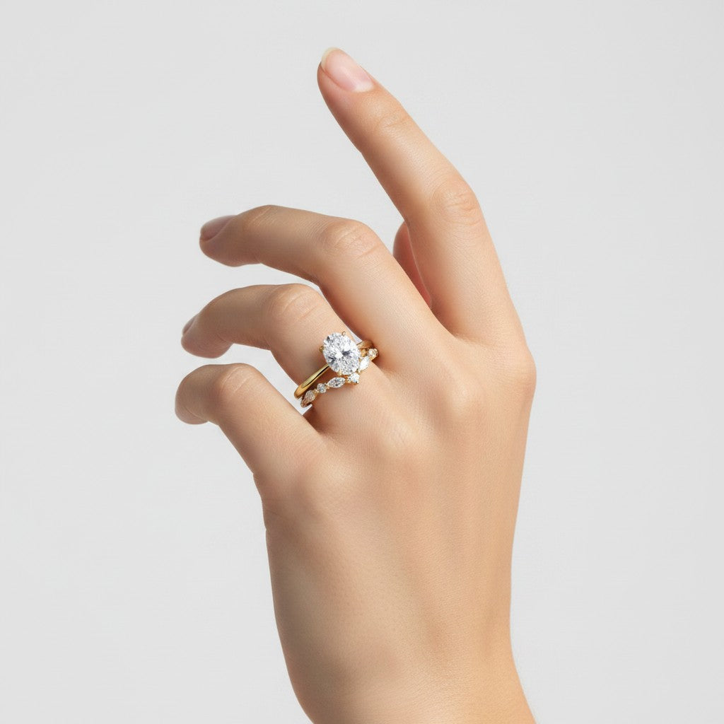 My Store 4 18K solid gold oval lab-grown diamond ring set worn on a woman's finger, showcasing elegant craftsmanship.
