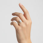 My Store 4 18K solid gold oval lab-grown diamond ring set worn on a woman's finger, showcasing elegant craftsmanship.