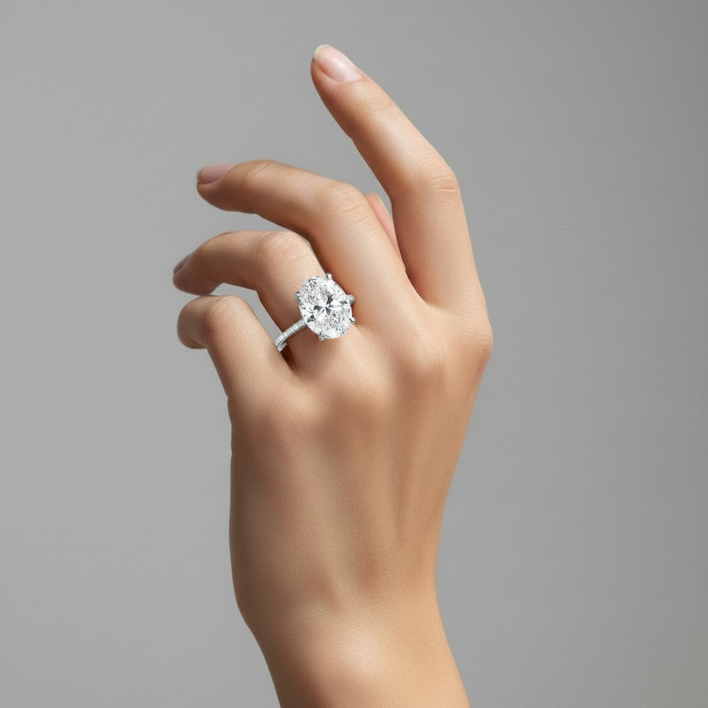 My Store 4 18K solid gold engagement ring featuring a 4 carat oval lab-grown diamond with hidden halo and pavé band.