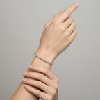 My Store 4 18K solid gold tennis bracelet featuring 8 carats of oval lab-grown diamonds on a model's wrist.