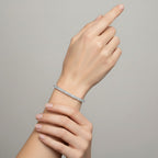 My Store 4 18K solid gold tennis bracelet featuring 8 carats of oval lab-grown diamonds on a woman's wrist