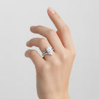 My Store 4 18K gold bridal set featuring an oval lab-grown diamond engagement ring and a V-shaped pavé wedding band.