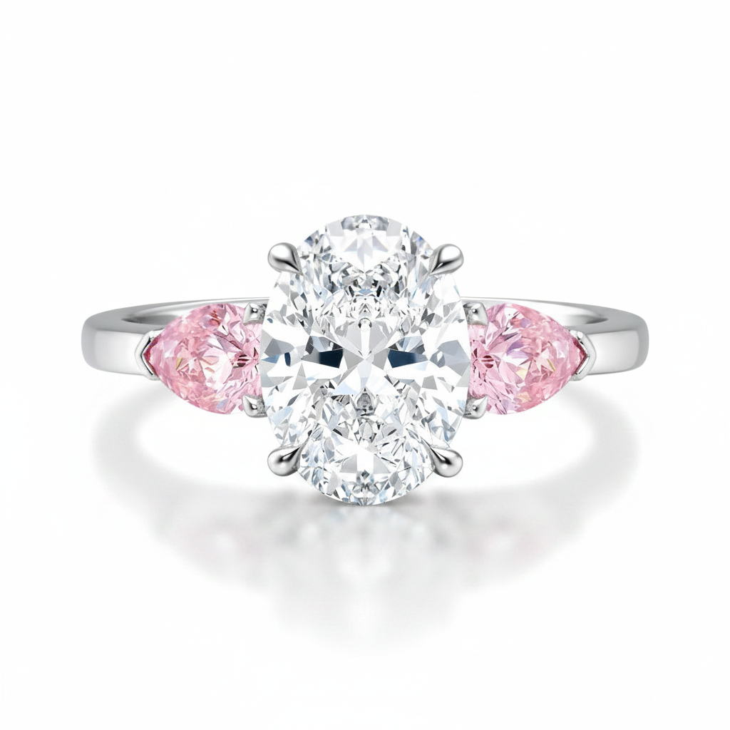 My Store 4 18K solid gold trilogy ring featuring a central oval diamond flanked by two pink pear-cut side diamonds.