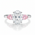 My Store 4 18K solid gold trilogy ring featuring a central oval diamond flanked by two pink pear-cut side diamonds.