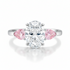 My Store 4 18K solid gold trilogy ring featuring a central oval diamond flanked by two pink pear-cut side diamonds.