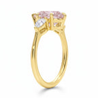 My Store 4 18K solid gold ring featuring an oval fancy pink diamond centerpiece with heart-shaped side diamonds.