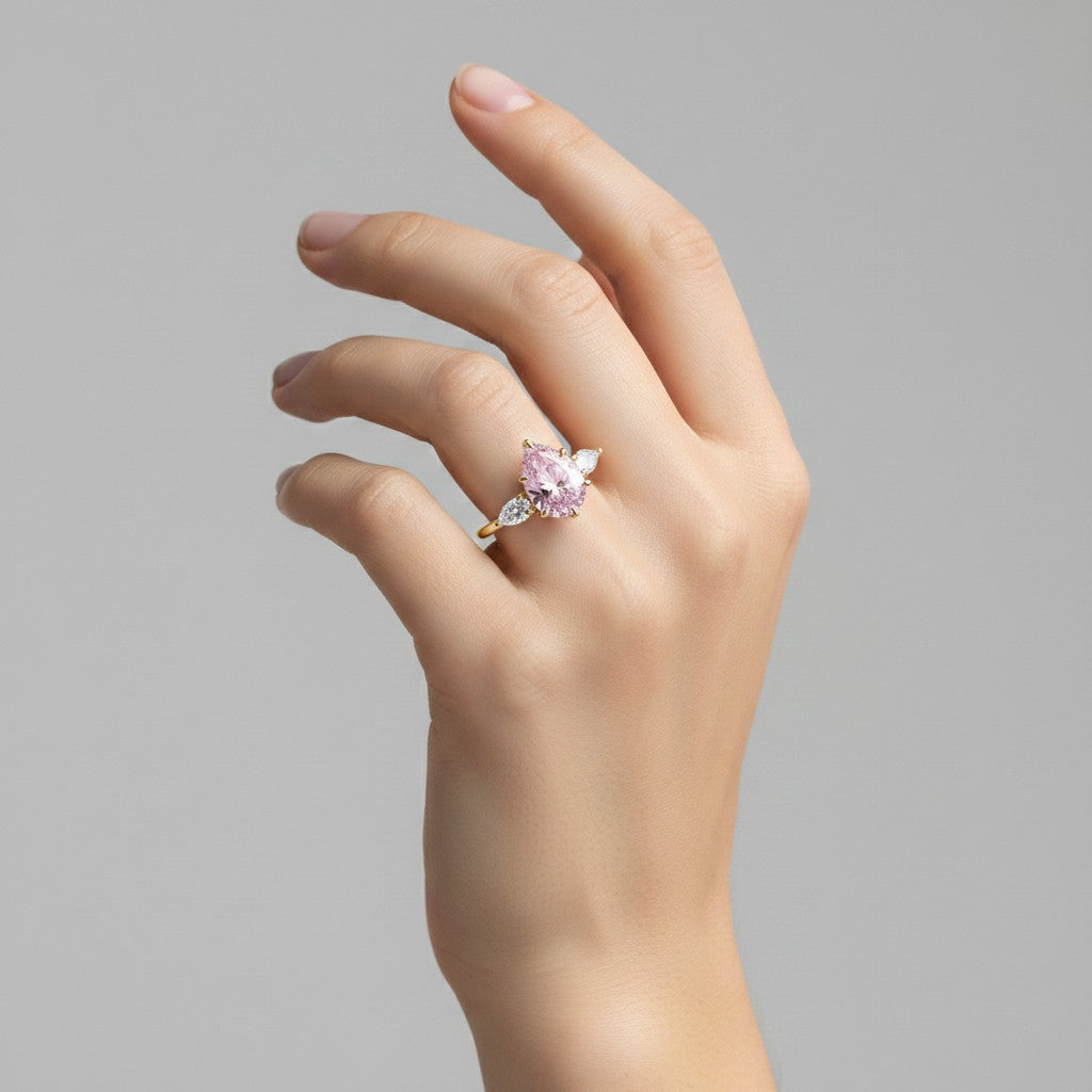 My Store 4 18K solid gold ring featuring a pink oval fancy color diamond with heart-shaped side stones on a hand