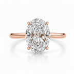 My Store 4 oval cut engagement ring with a brilliant center stone and four claw prongs on a polished rose gold band.