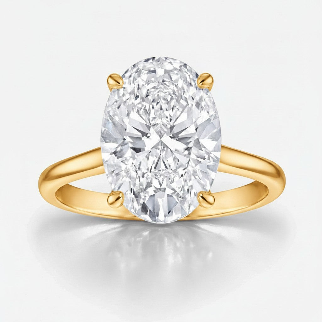 My Store 4 oval cut solitaire engagement ring with a brilliant center stone on a polished yellow gold band