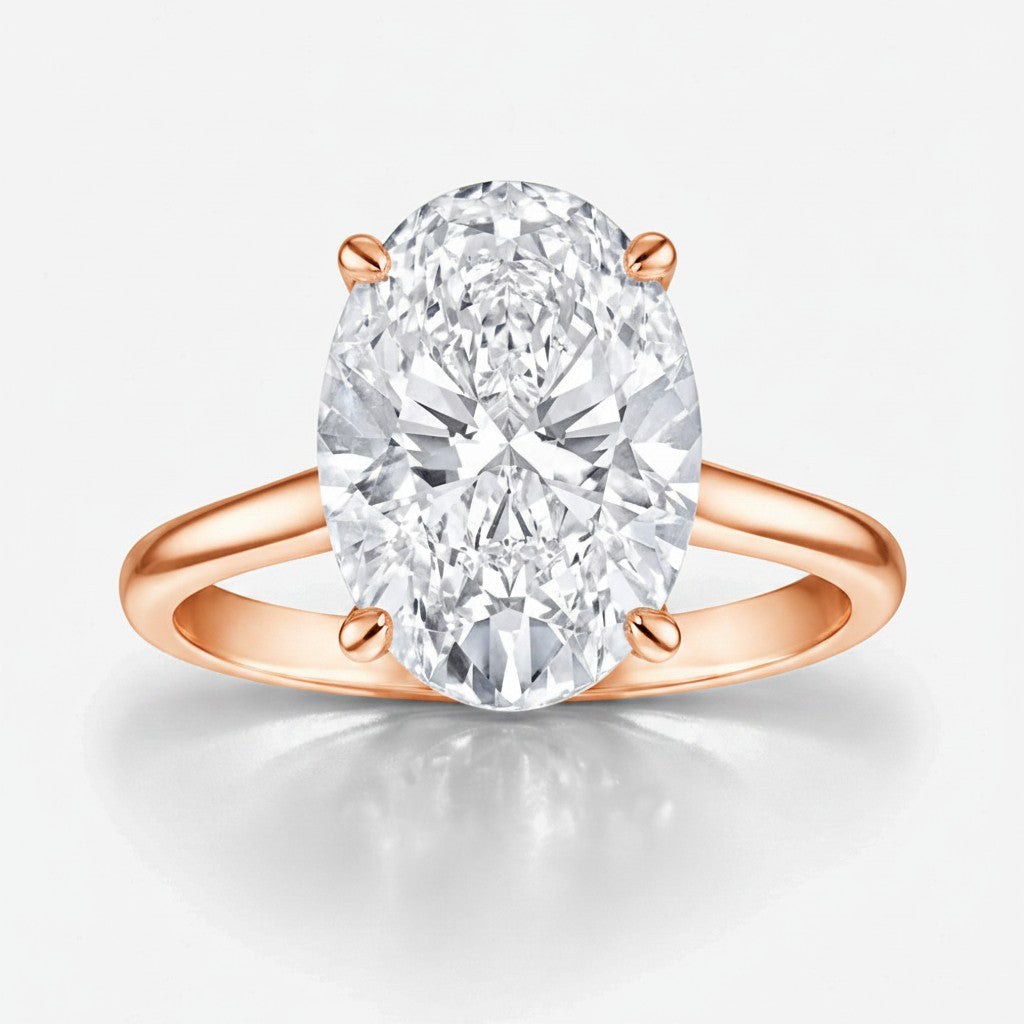 My Store 4 oval cut solitaire engagement ring with a brilliant center stone on a polished rose gold band.