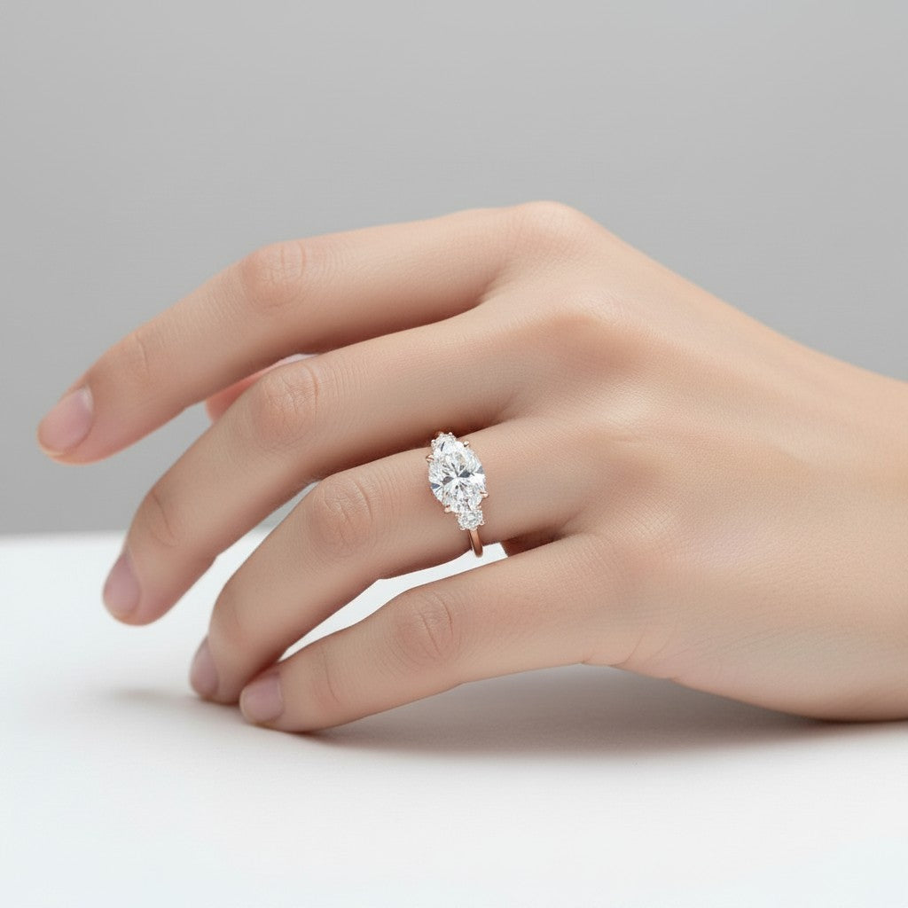 My Store 4 18K solid gold trilogy engagement ring featuring an oval-cut lab-grown diamond with oval side stones.