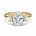 My Store 4 18K solid gold trilogy engagement ring featuring a large oval lab-grown diamond with oval side stones.