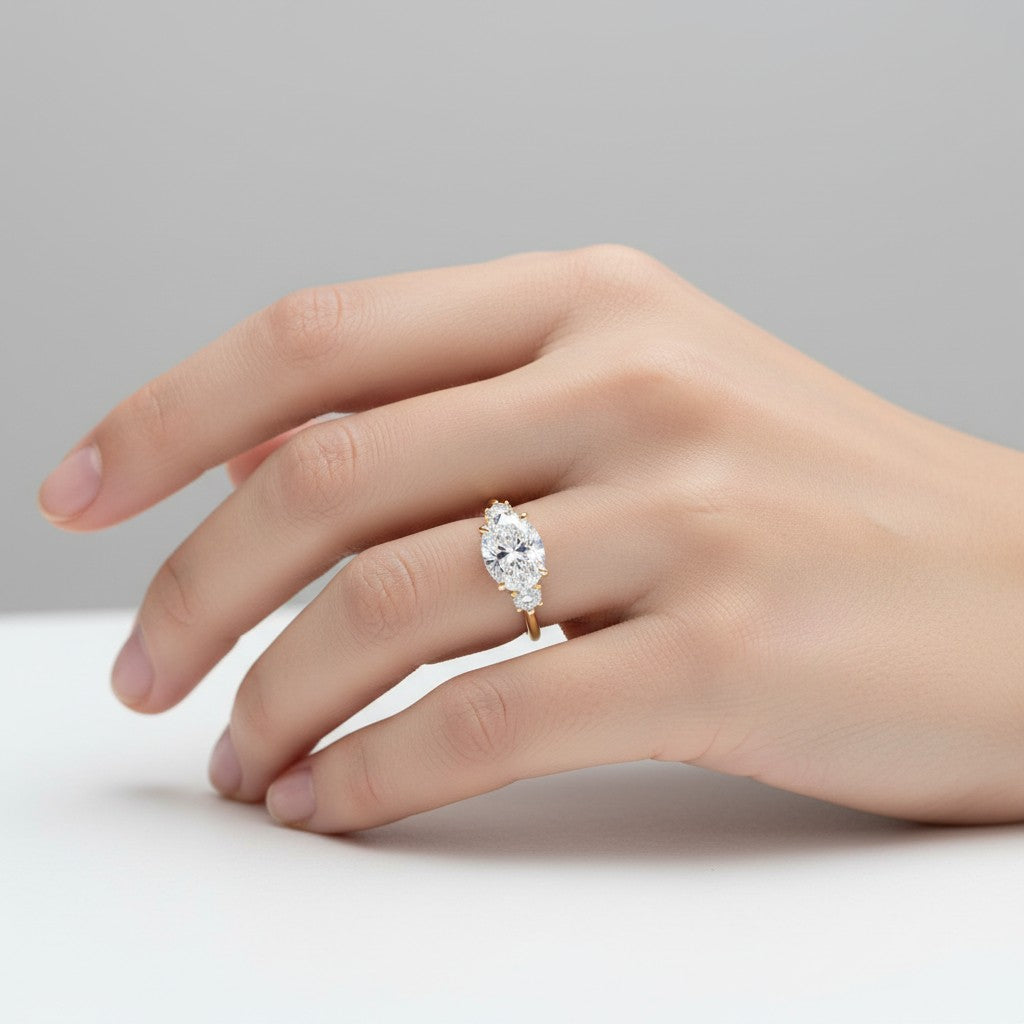 My Store 4 18K solid gold trilogy engagement ring featuring an oval-cut lab diamond with two oval side stones.