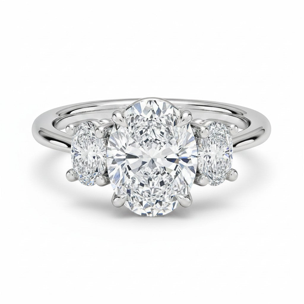 My Store 4 18K solid gold trilogy engagement ring featuring a central oval lab-grown diamond with oval side stones.
