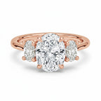 My Store 4 18K rose gold trilogy engagement ring featuring a large oval-cut lab diamond with two oval side stones.