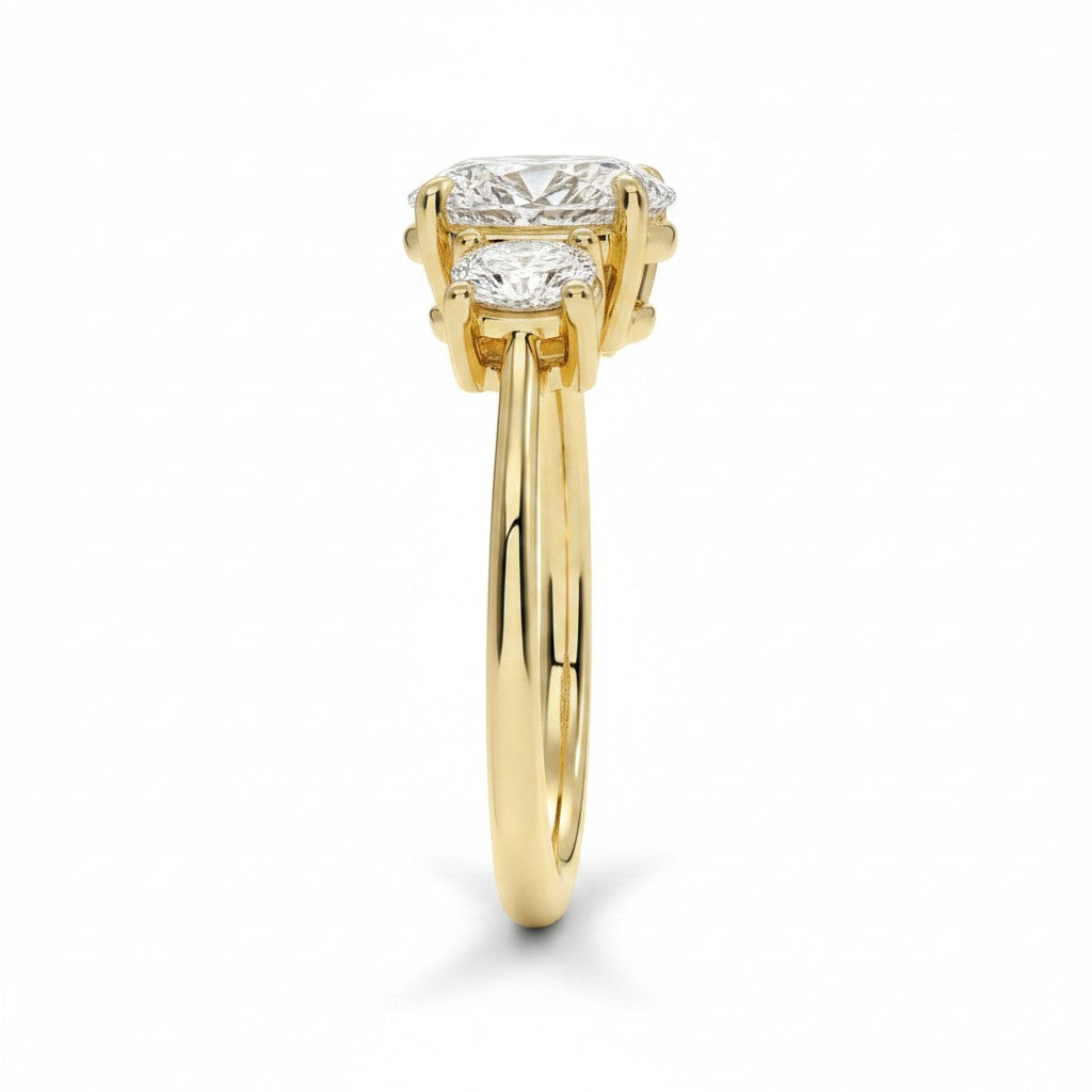 My Store 4 18K solid gold trilogy engagement ring featuring an oval-cut lab diamond with oval side stones, side view.