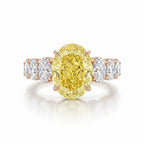 My Store 4 18K solid gold engagement ring featuring a large oval-cut fancy yellow lab-grown diamond with side stones.