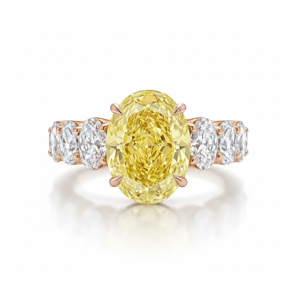 My Store 4 18K solid gold engagement ring featuring a large oval-cut fancy yellow lab-grown diamond with side stones.